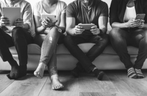 Group of diverse people using digital devices