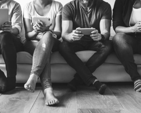 Group of diverse people using digital devices
